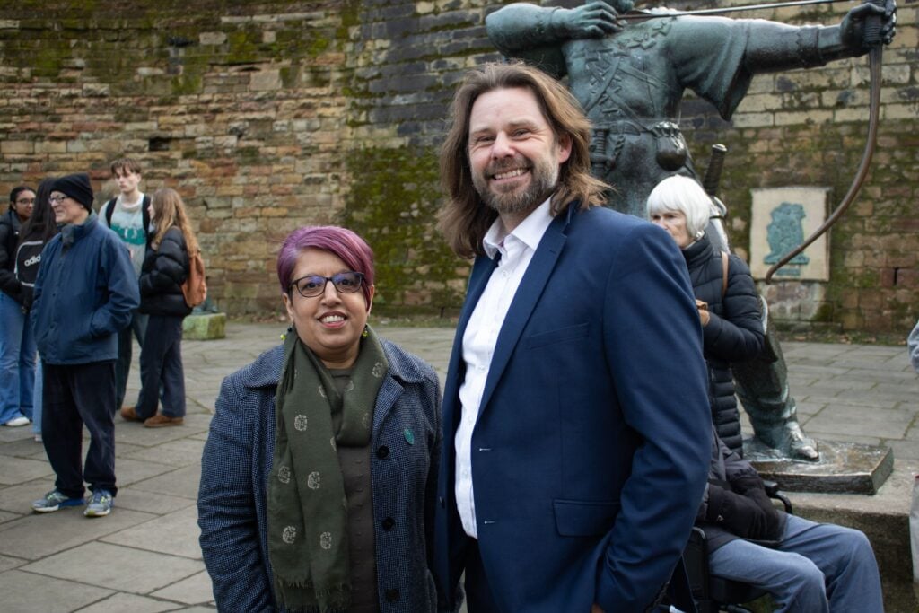 Nottingham Green Party co-chair Ben Gray welcomes Councillor Shuguftah Quddoos (photo by Ellie Jewson)